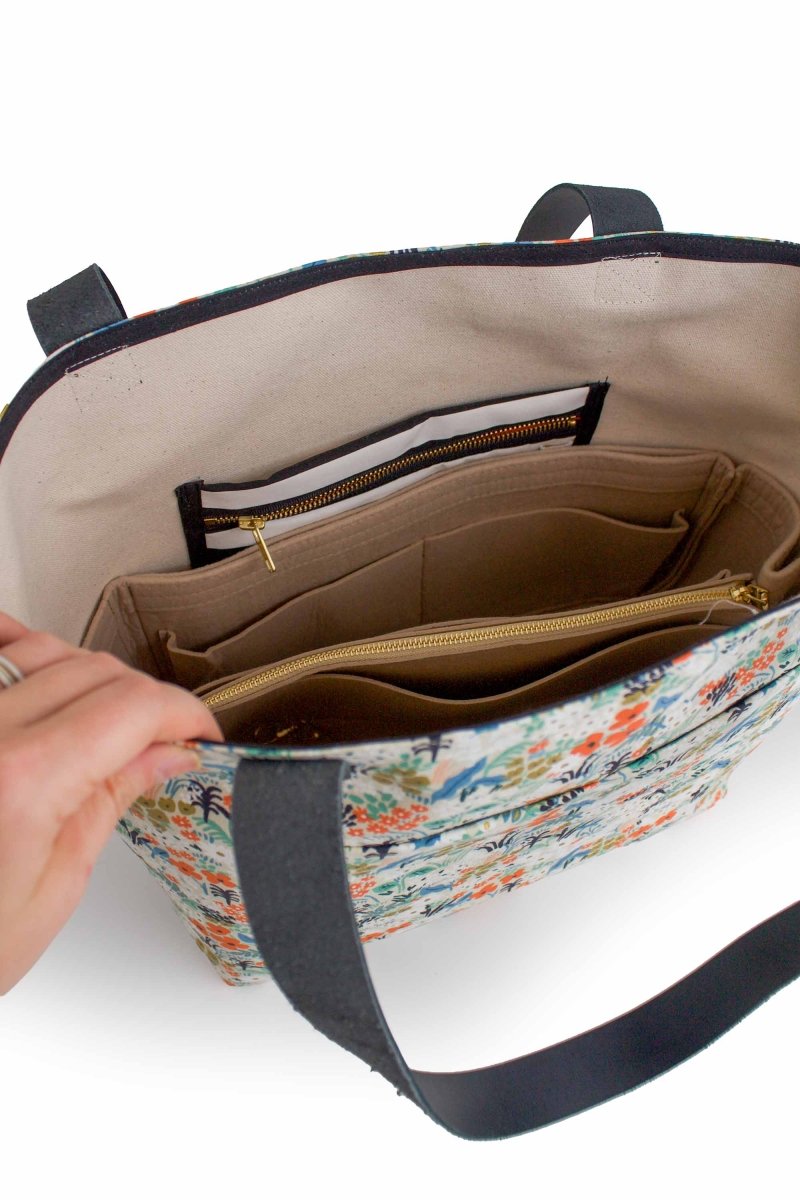 Top-down view showing the tote’s natural canvas lining and XL organizer insert in place.
